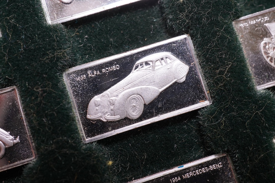 A cased set of one hundred 925 ingots, each depicting a different car model, each 27mm and weighing approximately 1.6 grams. Condition - good